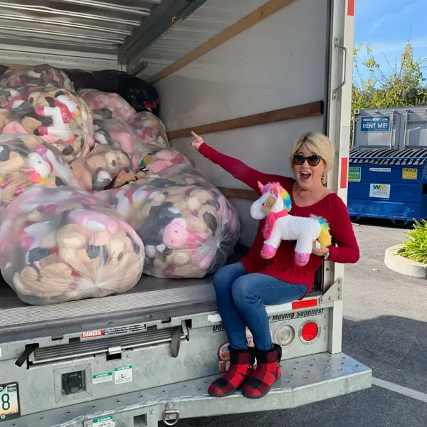 My Stuff Bags CEO with a Truck Full of Donated Items